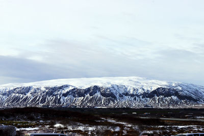 Scenic view of snowcapped mountains against sky