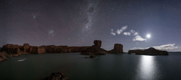 Scenic view of sea against sky at night