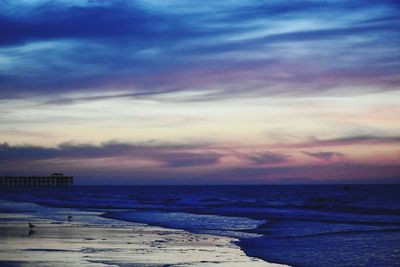 Scenic view of sea against sky at sunset