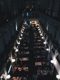 High angle view of people in illuminated building at night