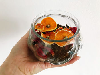 Close-up of person holding glass