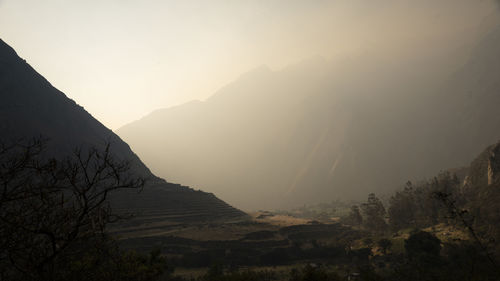 Scenic view of mountains against sky inthe morning dew 