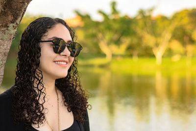 Portrait of young woman in lake