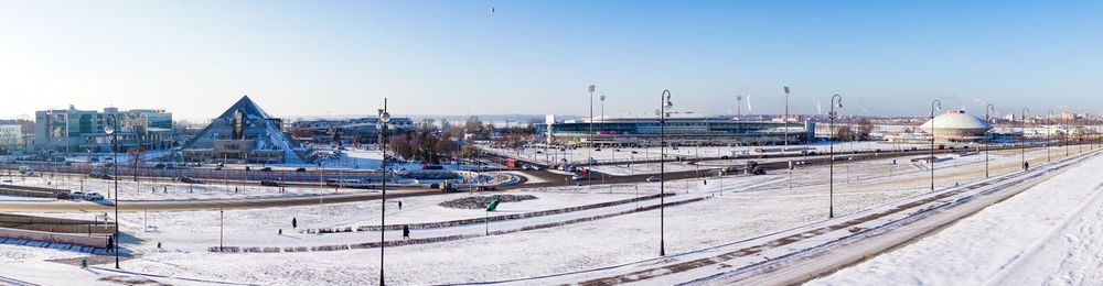 Panoramic view of buildings in city against clear sky