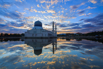 Scenic view of lake against sky during sunset