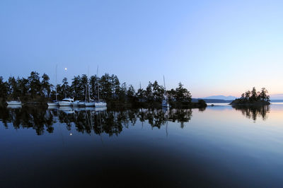 View of marina in lake against clear sky