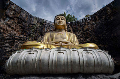 Low angle view of statue against sky