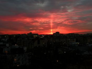 High angle view of illuminated buildings against sky during sunset