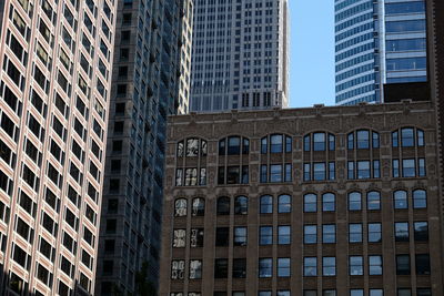 Low angle view of modern building in city against sky