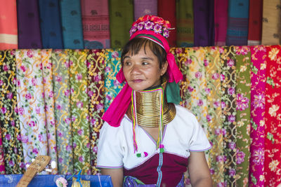 Portrait of smiling girl wearing hat standing outdoors