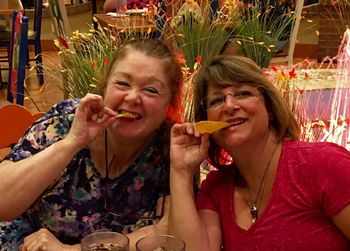 Portrait of a smiling young woman eating