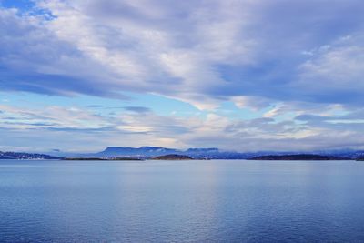 Scenic view of sea against blue sky