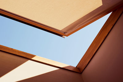 Open skylight with a piece of blue sky