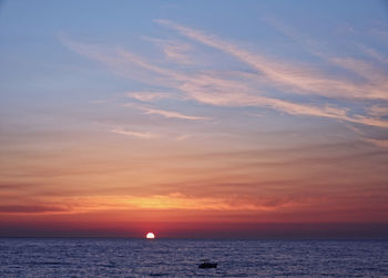 Scenic view of sea against sky during sunrise