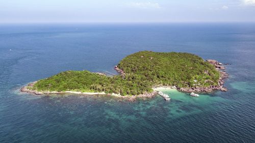 High angle view of island amidst sea against sky