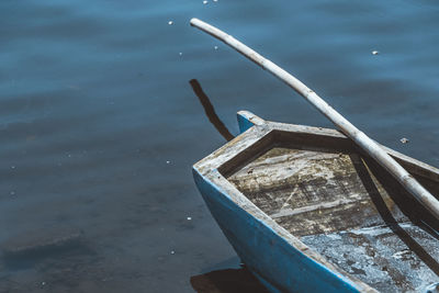Cropped image of boat moored on lake