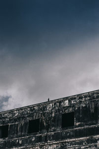 Low angle view of old building against sky