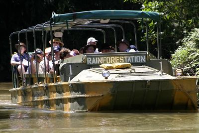 People on boat in river