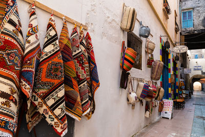 Multi colored flags hanging at market stall