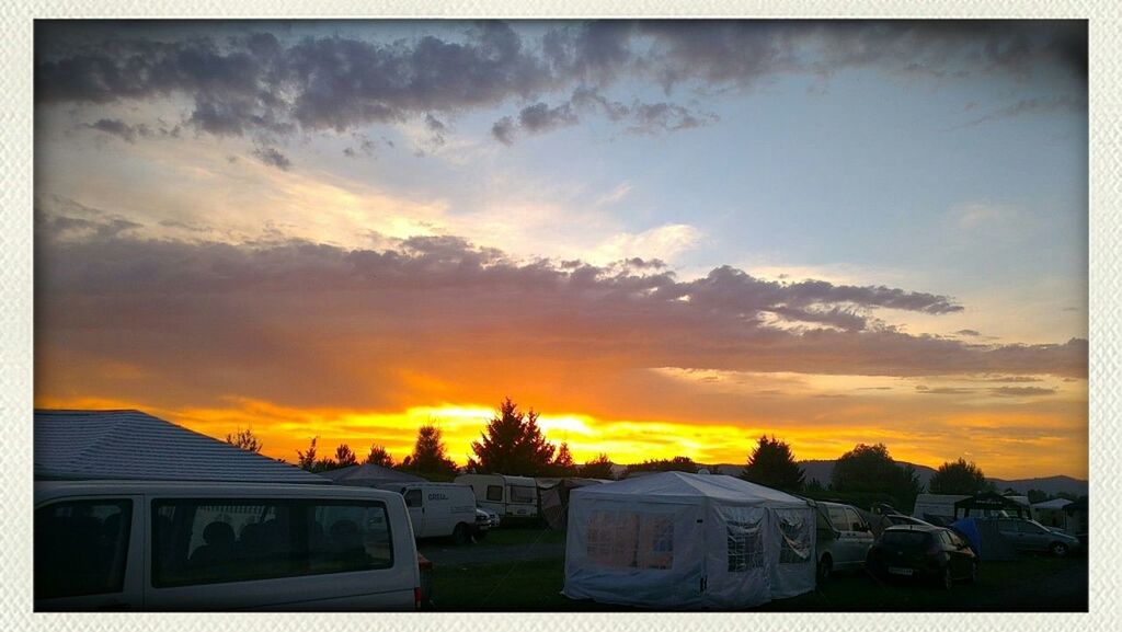 sunset, land vehicle, car, orange color, transfer print, transportation, sky, mode of transport, building exterior, auto post production filter, cloud - sky, architecture, built structure, dramatic sky, cloud, house, outdoors, nature, parking, silhouette