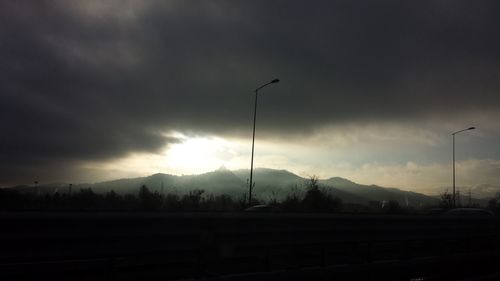 Scenic view of landscape against cloudy sky