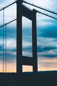 Silhouette bridge against sky during sunset