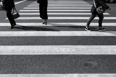 Low section of women on zebra crossing in city