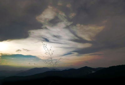 Scenic view of silhouette mountains against sky at sunset