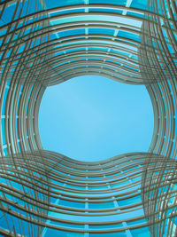 Low angle view of spiral staircase against clear blue sky