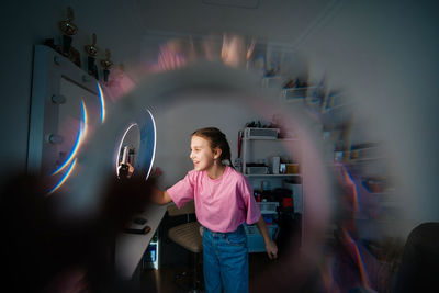 Girl teenager records video uses smartphone