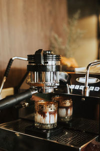 Close-up of coffee machine on table