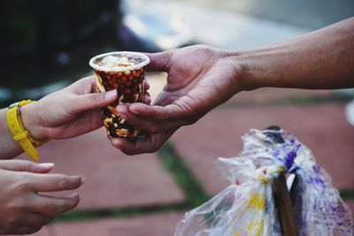 Close-up of hand holding ice cream