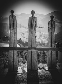 Rear view of people standing on mountain against sky