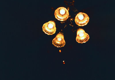 Low angle view of illuminated light bulb