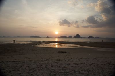 Scenic view of beach against sky during sunset