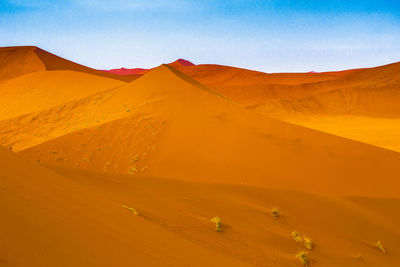 Scenic view of desert against clear sky