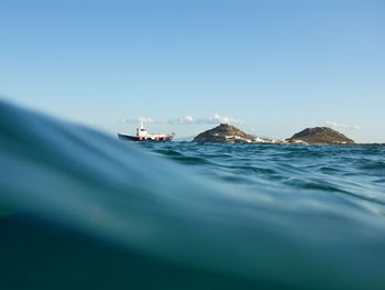 Scenic view of sea against blue sky