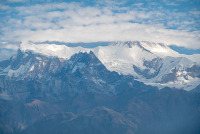 Scenic view of snowcapped mountains against sky