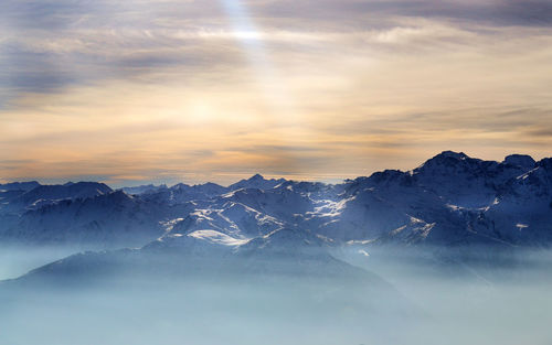 Scenic view of mountains against sky during sunset