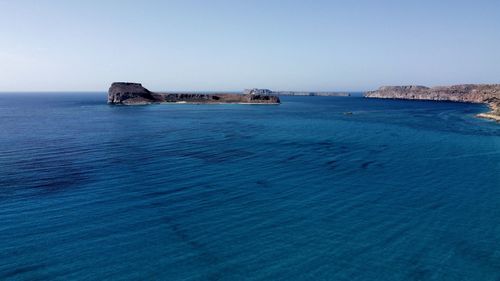 Scenic view of sea against clear sky