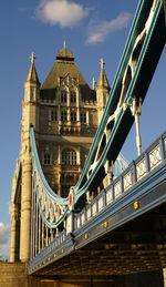 Low angle view of bridge against buildings