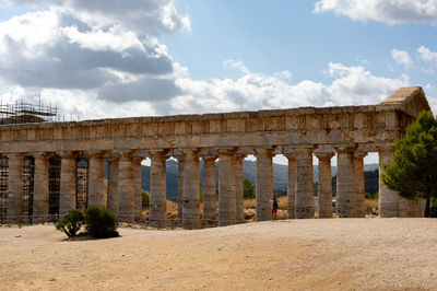 Old ruin building against cloudy sky