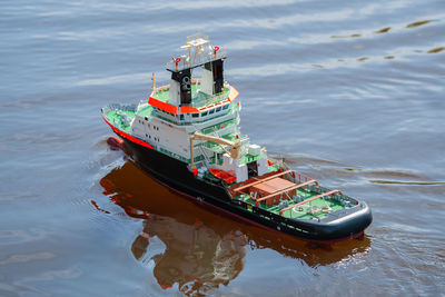 Remote controlled ship model is remote controlled on a lake