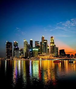 View of city skyline against blue sky