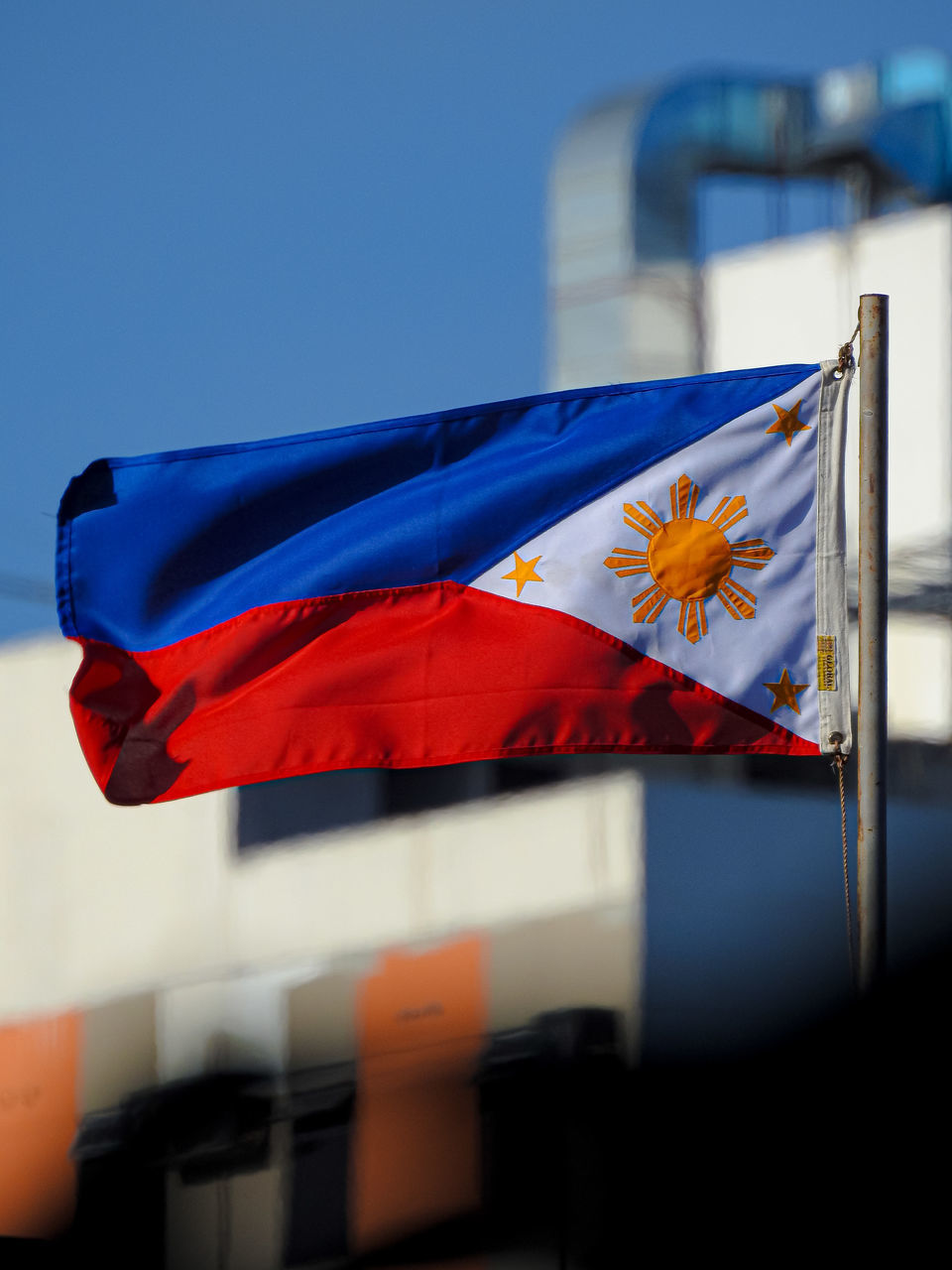 LOW ANGLE VIEW OF FLAG AGAINST CLEAR SKY