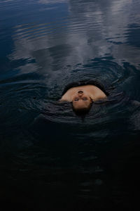 Portrait of woman swimming in sea