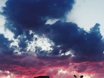 Low angle view of cloudy sky at sunset