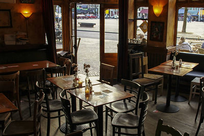 Empty chairs and tables in restaurant