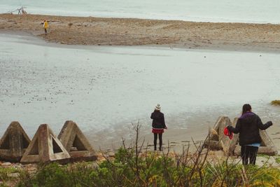 People standing on beach