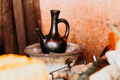 Close-up of old tea light on wall